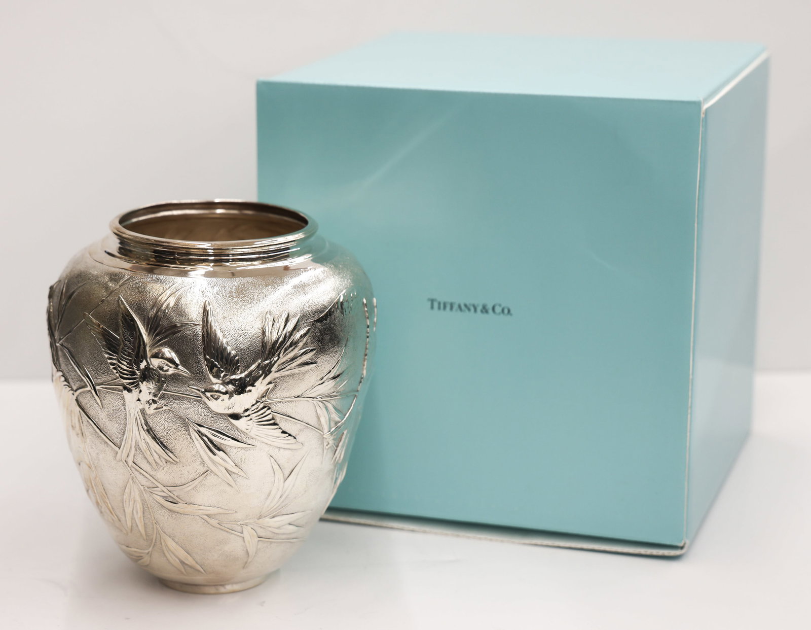 Tiffany & Co. Audubon Sterling Bird Vase: Tiffany & Co. Audubon (Japanese) Sterling Bird Vase 7''x6.5''. Ornate aesthetic birds and branch motifs. Marked on bottom. Excellent condition with no monograms. Comes with original blue box and felt.