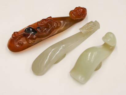 3pc Chinese Jade and Carnelian Belt Hooks: 3pc Chinese Jade and Carnelian Belt Hooks 2.5'' to 4''. Includes a pale whitish to celadon jade dragon hook, a carnelian dragon hook with chilong, and a jade duck or swan hook. Excellent condition.
