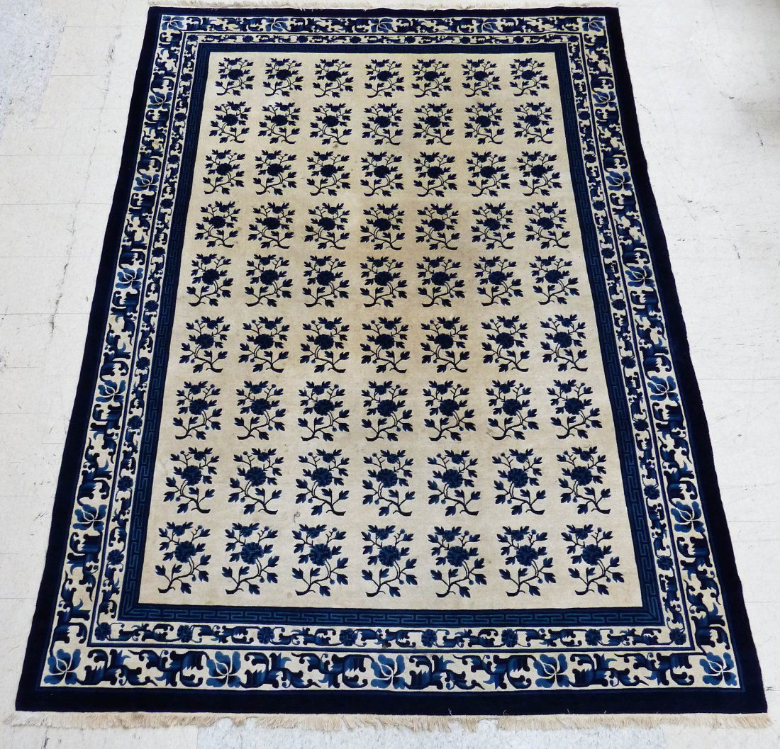 Antique Chinese Peking Blue & White Floral Pattern: Antique Chinese Peking Blue & White Floral Pattern Oriental Rug 8'x12'. Some slight staining.