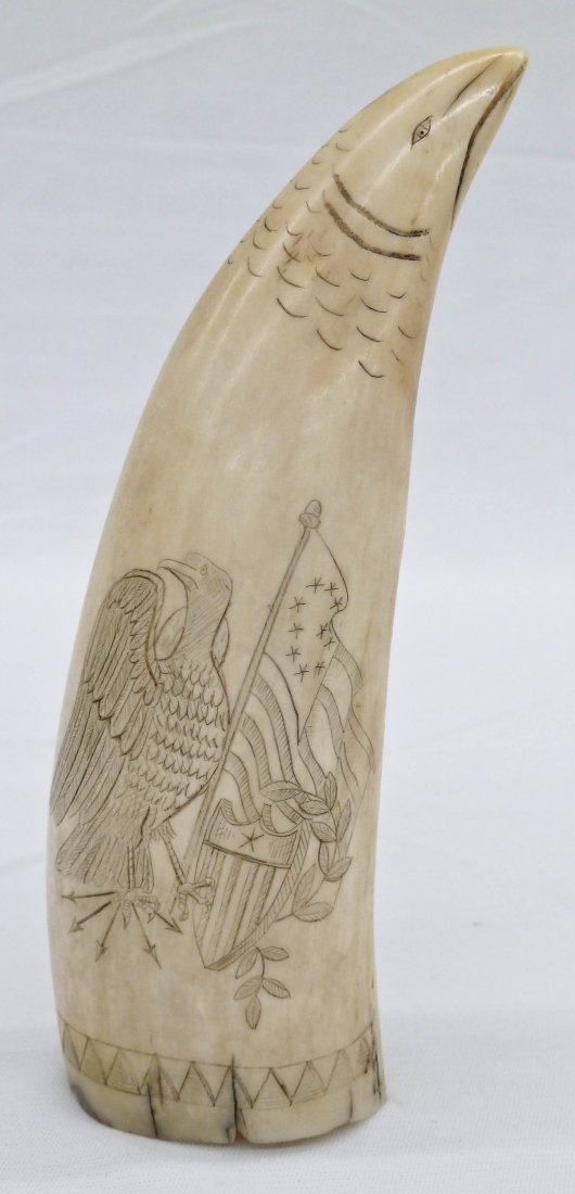 American Scrimshaw Ivory Whale Tooth 5.5'' with: American Scrimshaw Ivory Whale Tooth 5.5'' with Eagle, Shield, & 10 Star Flag. Eagle head depicted at top. Natural cracking at base.