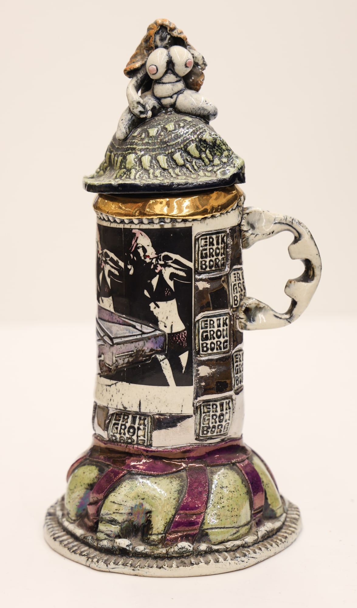 Erik Gronborg Muscle Car Covered Vessel: Erik Gronborg (b.1931 American) ''Muscle Car Covered Vessel'' Glazed Ceramic 12''x6''. Funk pottery with lustre glazes and women decals. Hand built nude finial. Impressed signatures. Excellent conditi