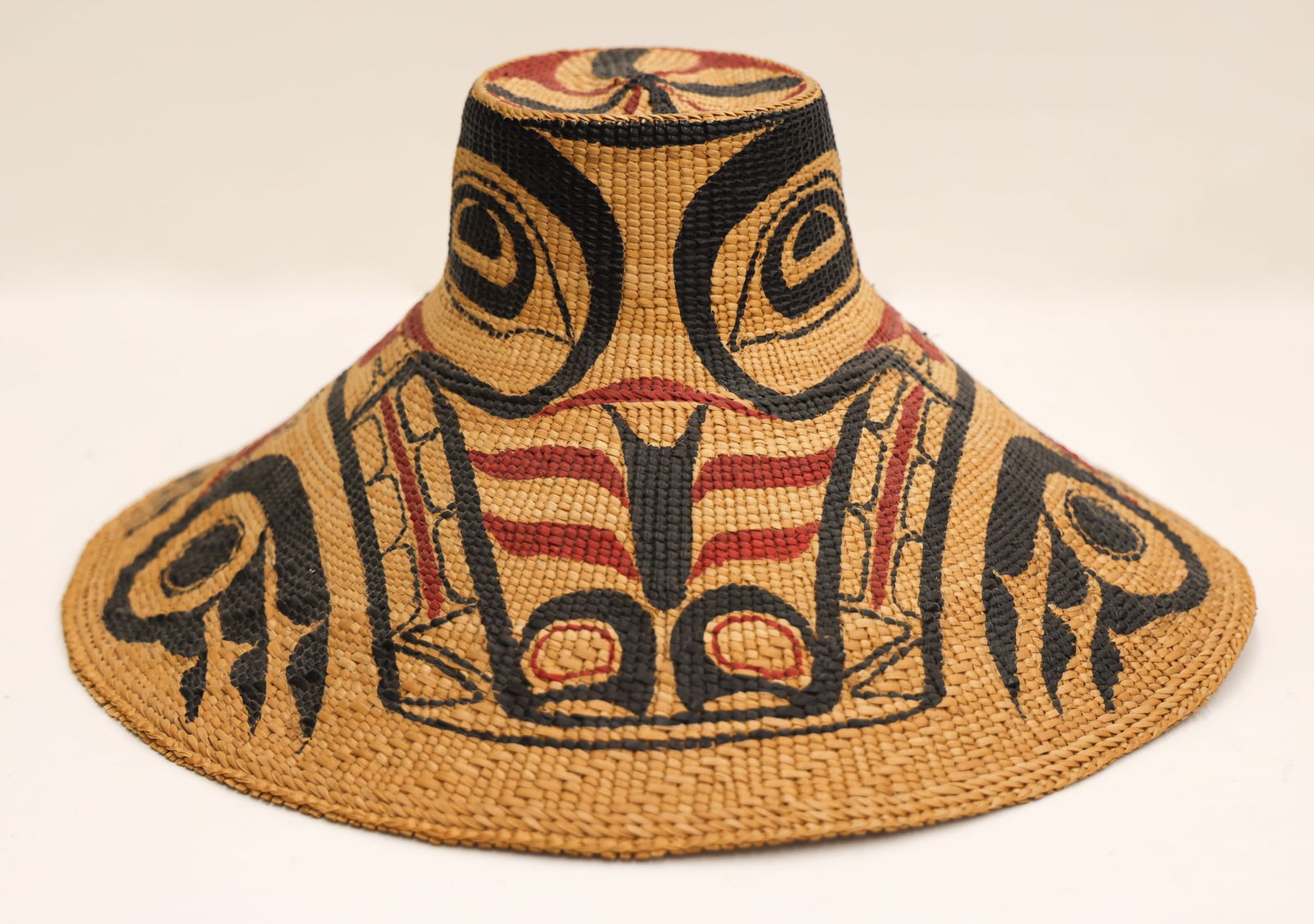 Nathan Jackson ''Painted Haida Hat'' Spruce: Nathan Jackson (b.1938 Tlingit) ''Painted Haida Hat'' Spruce Root 6.5''x14''. Museum quality polychrome u-form wolf hat with weaving attributed to Selina Peratrovich (1900-1984 Haida). Excellent condi