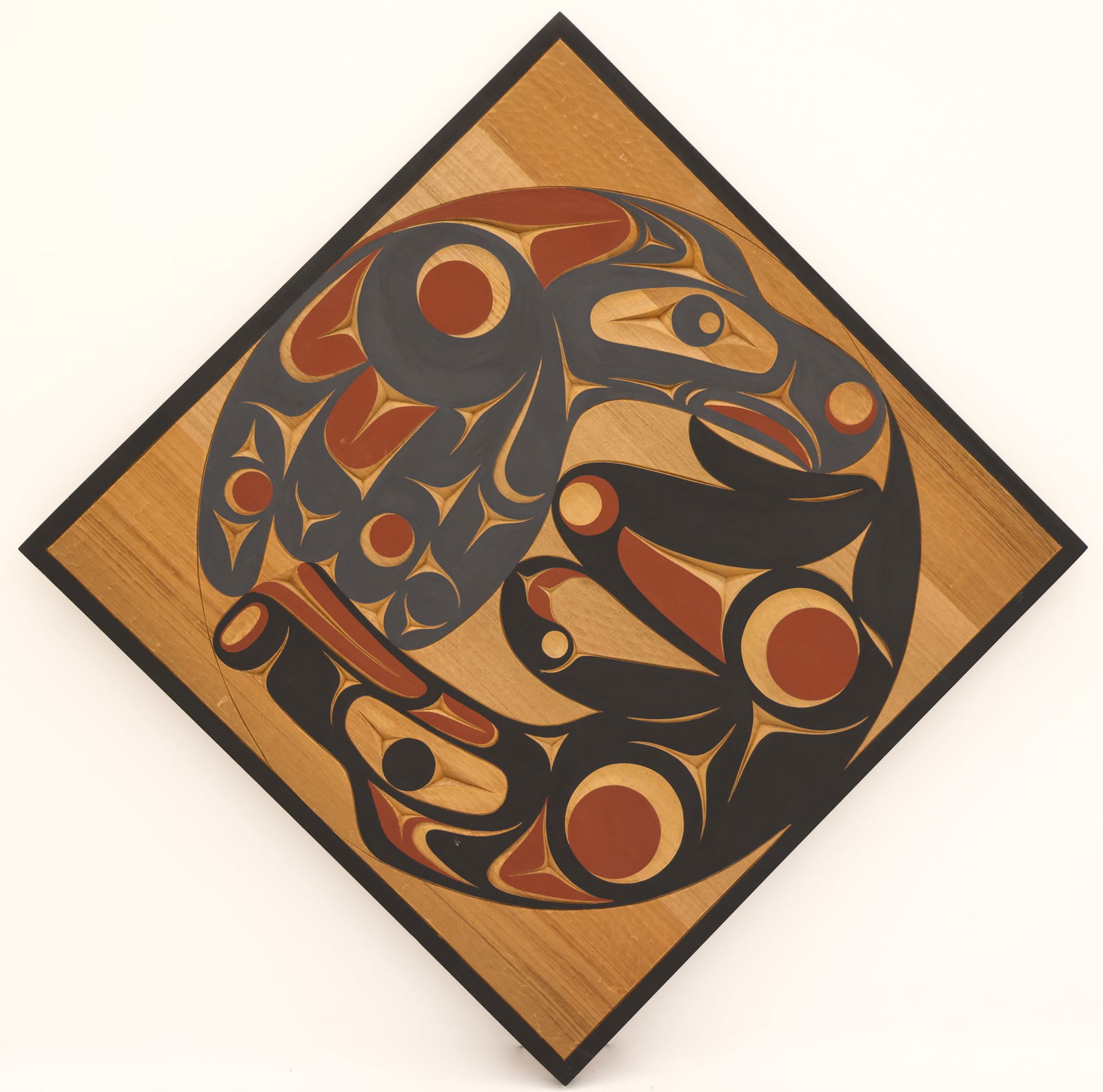 Andy Wilbur Peterson ''Thunderbird & Wolf'' Cedar Plaque: Andy Wilbur Peterson (b.1955 Skokomish) ''Thunderbird & Wolf'' Cedar Diamond Plaque 28''x28''. Carved and polychrome painted plaque decorated by wife Ruth Peterson. Signed and titled on verso. Excelle