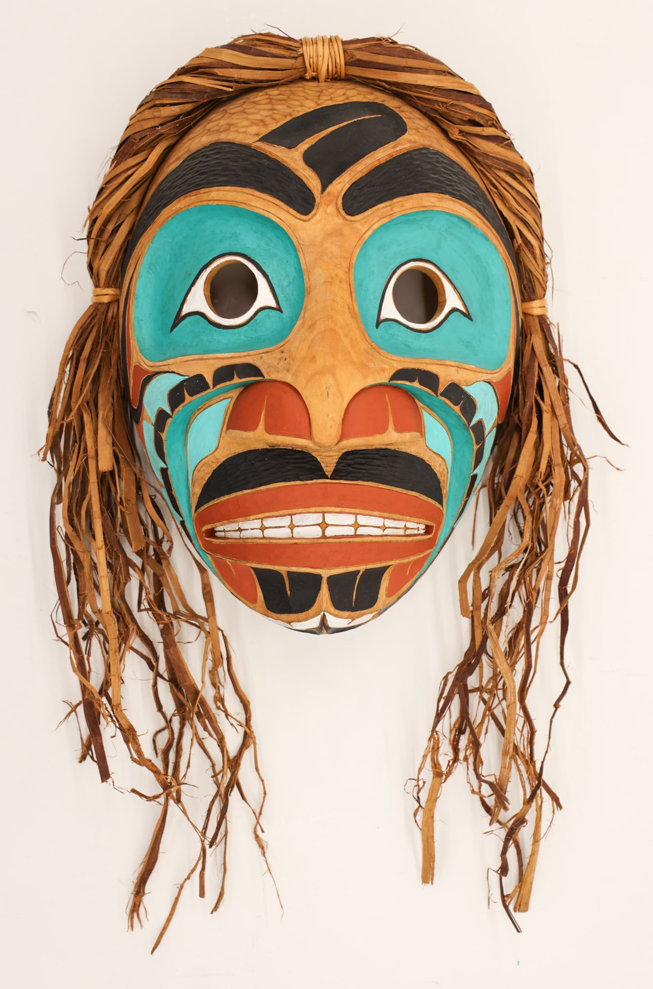 Northwest ''Thunder Spirit'' 2004 Maple Wood Mask: Northwest ''Thunder Spirit'' 2004 Maple Wood Mask 15''x12''x6''. Carved and polychrome painted with cedar bark woven hair measuring 24'' in total length. Illegibly signed on verso. Excellent condition