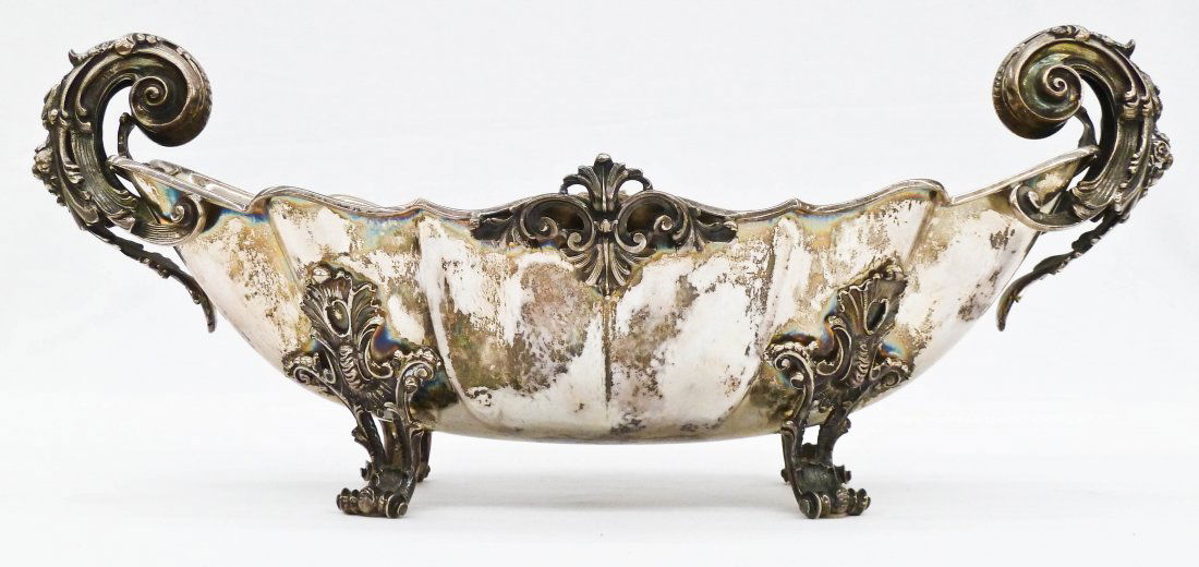 Impressive Mario Buccellati Italian Sterling Rococo: Impressive Mario Buccellati Italian Sterling Rococo Scrolled Handle Centerpiece Bowl 7''x17.5''. Weighing a solid 56.68 troy ounces. Dating from 1934-1944 per marks. No damage.