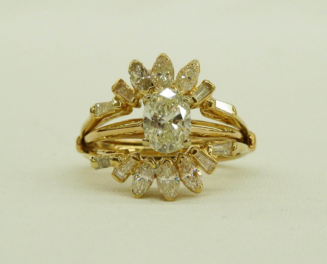 14k Diamond Wedding Ring Set with .99ct Oval Brill: 14k Diamond Wedding Ring Set with .99ct Oval Brilliant Cut Center Stone VS-2 Color F-G. Approximately 2.5ct diamond total weight with VVS/VS color F-G side stones. Comes with appraisal.