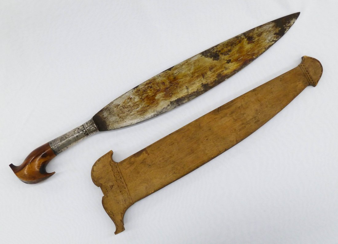 Antique Indonesian Kris Silver Mounted Sword with : Antique Indonesian Kris Silver Mounted Sword with Wood Scabbard 23.5''. Some cracking to carved wood handle.