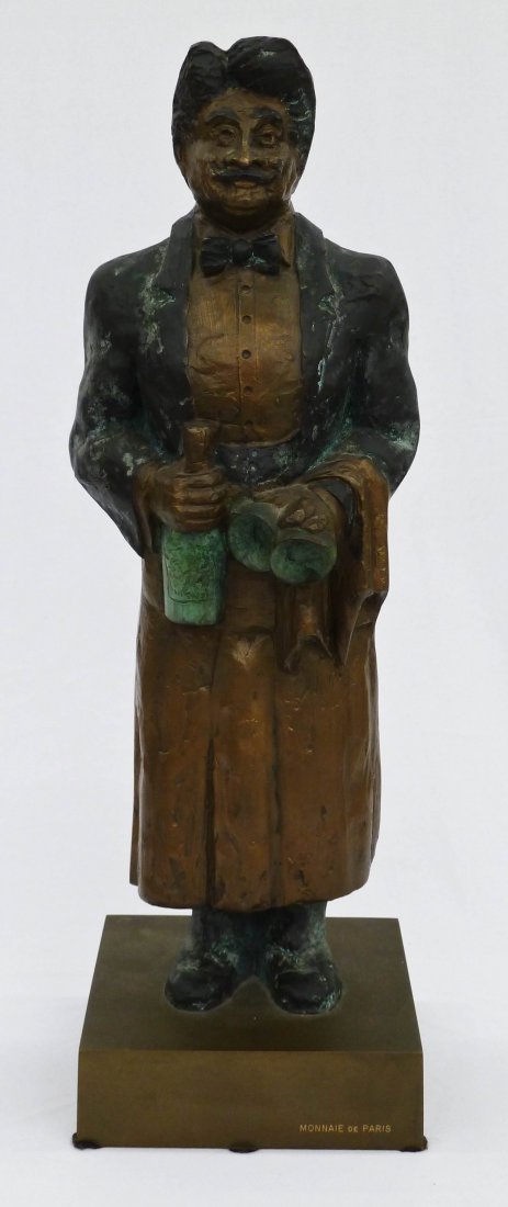 Guy Buffet (b.1943 HI) Le Sommelier ''Gaston'' Bro: Guy Buffet (b.1943 HI) Le Sommelier ''Gaston'' Bronze Sculpture 17''x5.5''. Numbered 21 of 300 on the back of base. Monnaie de Paris foundry marks. Comes with book on artist.