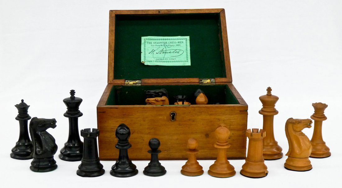 Antique Jaques Staunton Carved Boxwood Chess Set in Ori: Antique Jaques Staunton Carved Boxwood Chess Set in Original Box. Complete set with various chipping to pieces. Box has original paper label inside lid. Each king is 4" tall and the rook/castle have c