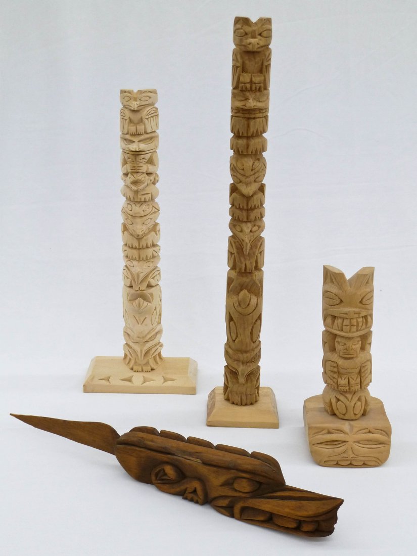 Group (4) Northwest John Williams Carved Totem Poles. I: Group (4) Northwest John Williams Carved Totem Poles. Includes 15'', 12'', and 7'' totems and a 14'' letter opener.