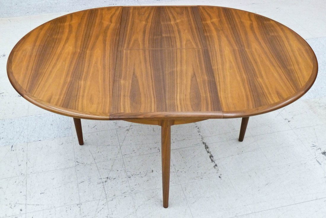 Neils O. Moller Denmark Teak Oval Dining Table 48''x48': Neils O. Moller Denmark Teak Oval Dining Table 48''x48''x28.5''. Includes one 20'' folding skirted leaf not included in measurement. Excellent condition.