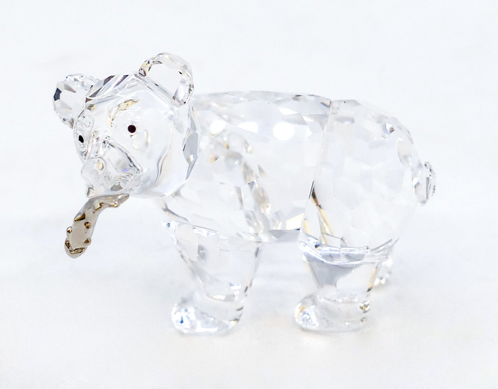 Swarovski Crystal "Grizzly Cub w/ Fish" 2": Swarovski Crystal "Grizzly Cub w/ Fish" 2". Catalog #7637NR000007. Includes original box.