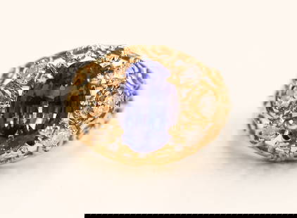 Ladies 14k Tanzanite and Diamond Ring: Ladies 14k Tanzanite and Diamond Ring Size 6. Includes one transparent, medium-dark to violetish-blue oval mixed cut tanzanite zoisite measuring 10.51x6.92x4.81mm, clarity L2. Also (6) round