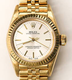 Ladies Rolex Oyster Perpetual 18k Presidential Wrist Watch Ref.67198: Ladies Rolex Oyster Perpetual 18k Presidential Wrist Watch Ref.67198. Silver dial with 24mm bezel. Solid 18k gold case and jubilee band 8571. Serial number N447127, year of manufacture 1991. Overall e