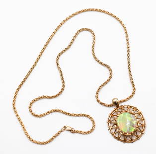 Vintage 14k Opal Pendant Wheat Chain Necklace: Vintage 14k Opal Pendant Wheat Chain Necklace 24". Includes a 7.04ct natural crystal opal cabochon measuring 19.25x16.24x3.61mm with moderately strong intensity. Pendant measures 41.3x32.5mm and sits