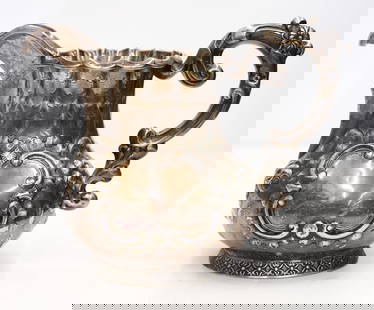 Antique Hyde & Goodrich New Orleans Coin Silver Pitcher: Antique Hyde & Goodrich New Orleans Coin Silver Pitcher 9"x11". Deep floral repousse and engraved motifs. Monogrammed "GRJ" within medallion. A few minor small surface marks. Overall excellent