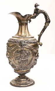 Antique Renaissance Style Silver Repousse Claret Jug: Antique Renaissance Style Silver Repousse Claret Jug 14"x7.5". Hand chased and repousse medallions and fruits of plenty with figural handle. Unmarked, tested silver. Base has been crunched down and