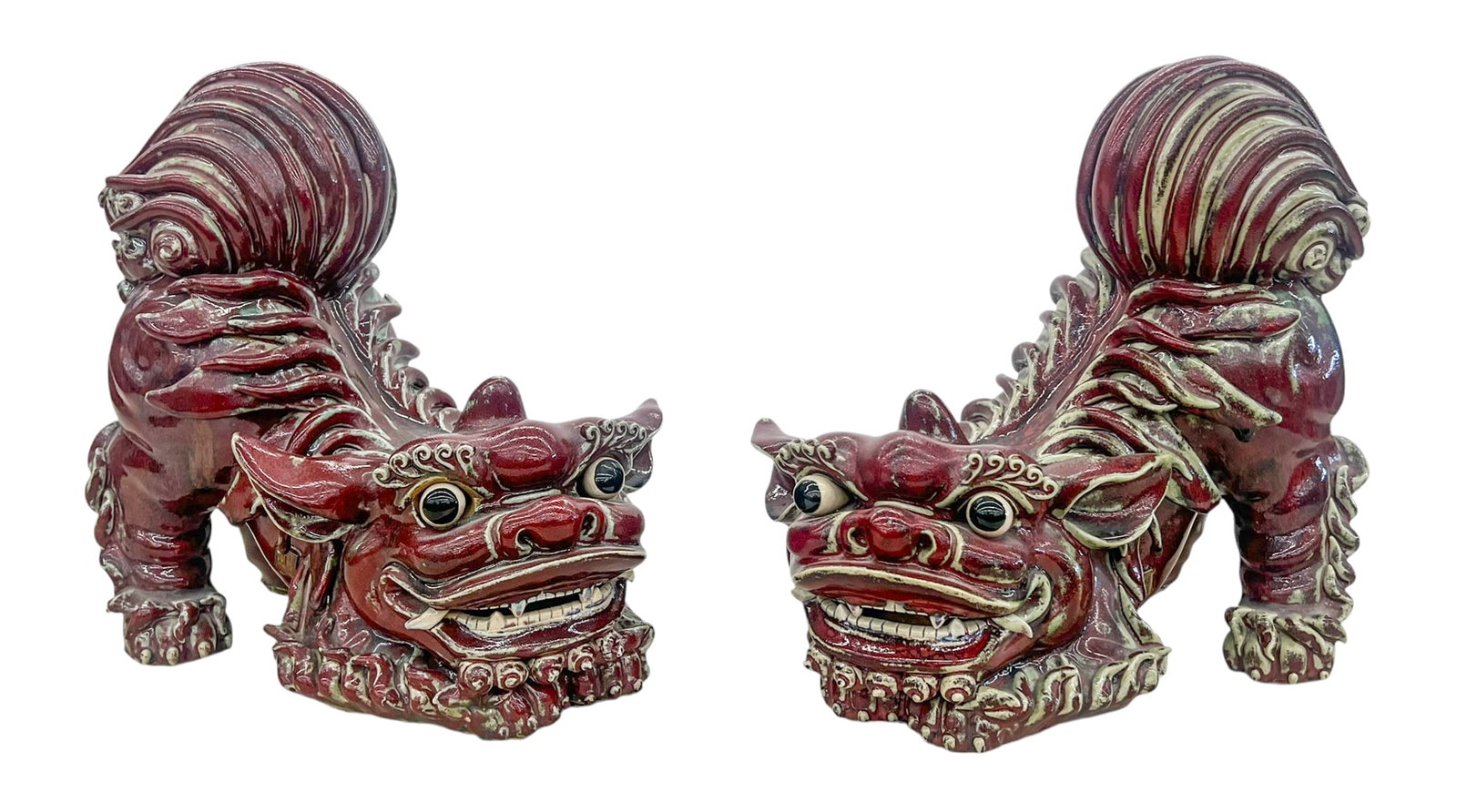 Pair Huo Lan Chinese Flambe Shiwan Foo Lions: Pair Huo Lan (b.1936 Chinese) Chinese Flambe Shiwan Foo Lions 10.5"x12". True opposing dramatic pair. Signed with impressed seal marks near underside. A few small edge chips and repairs to hair orname