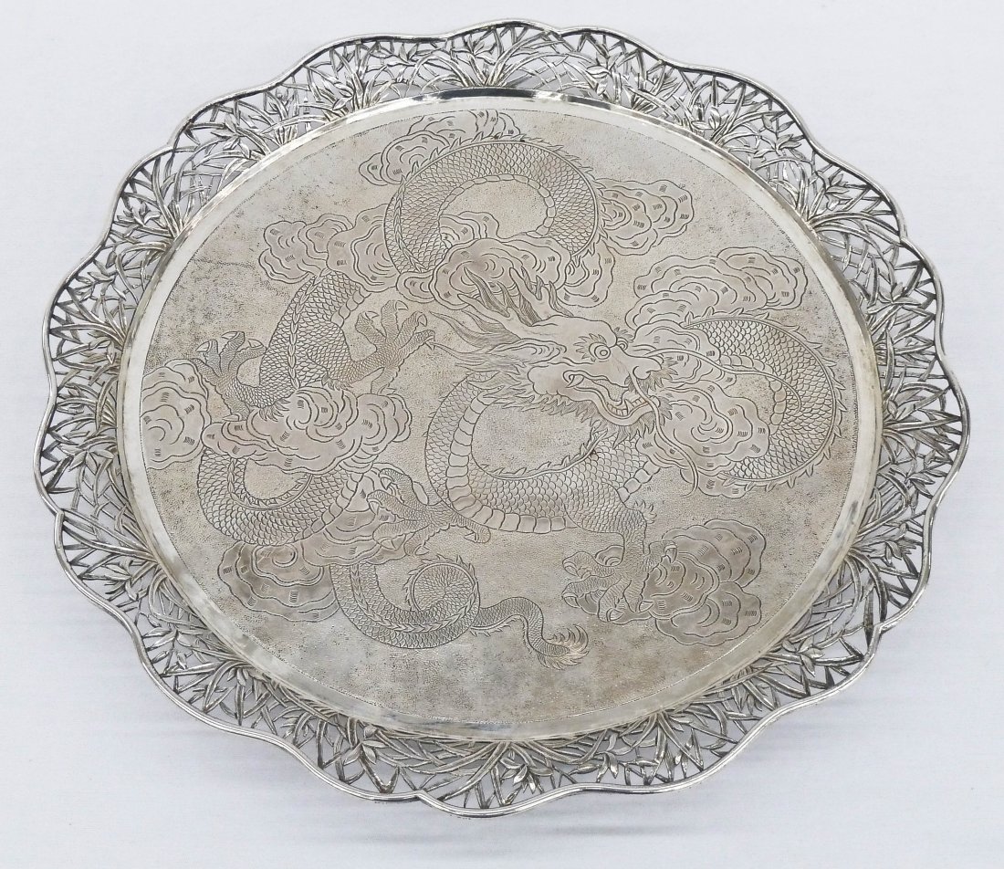 Wang Hing Chinese Export Silver Footed Dragon Tray 13.5: Wang Hing Chinese Export Silver Footed Dragon Tray 13.5''x1.25''. Depicts an etched five clawed dragon swimming through clouds. Pierced edges with lotus flowers and grasses. It weighs 31.8 troy ounces