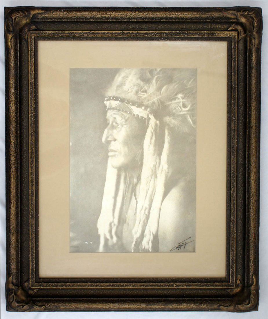 Edward Curtis (1868-1952 WA) ''White Swan'' Indian Chie: Edward Curtis (1868-1952 WA) ''White Swan'' Indian Chief Platinum Print Photograph 15''x11'' Image. The piece is signed in ink and has Curtis Studios blind stamp l.l. Negative number 285-05. This imag