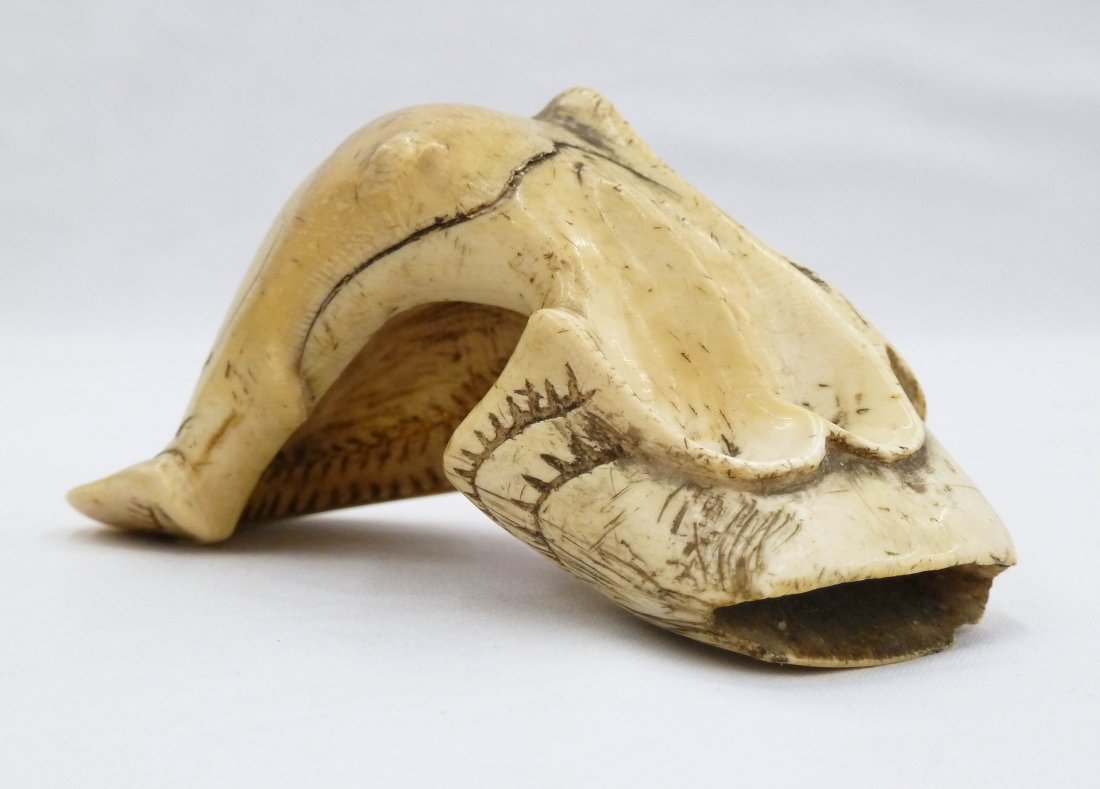 Alaskan Indian Inuit Carved Whale Tooth Palm Scraper 4.: Alaskan Indian Inuit Carved Whale Tooth Palm Scraper 4.75''x2.5''. Early to mid 19th century with geometric design around back side. Museum quality. Missing stone blade.