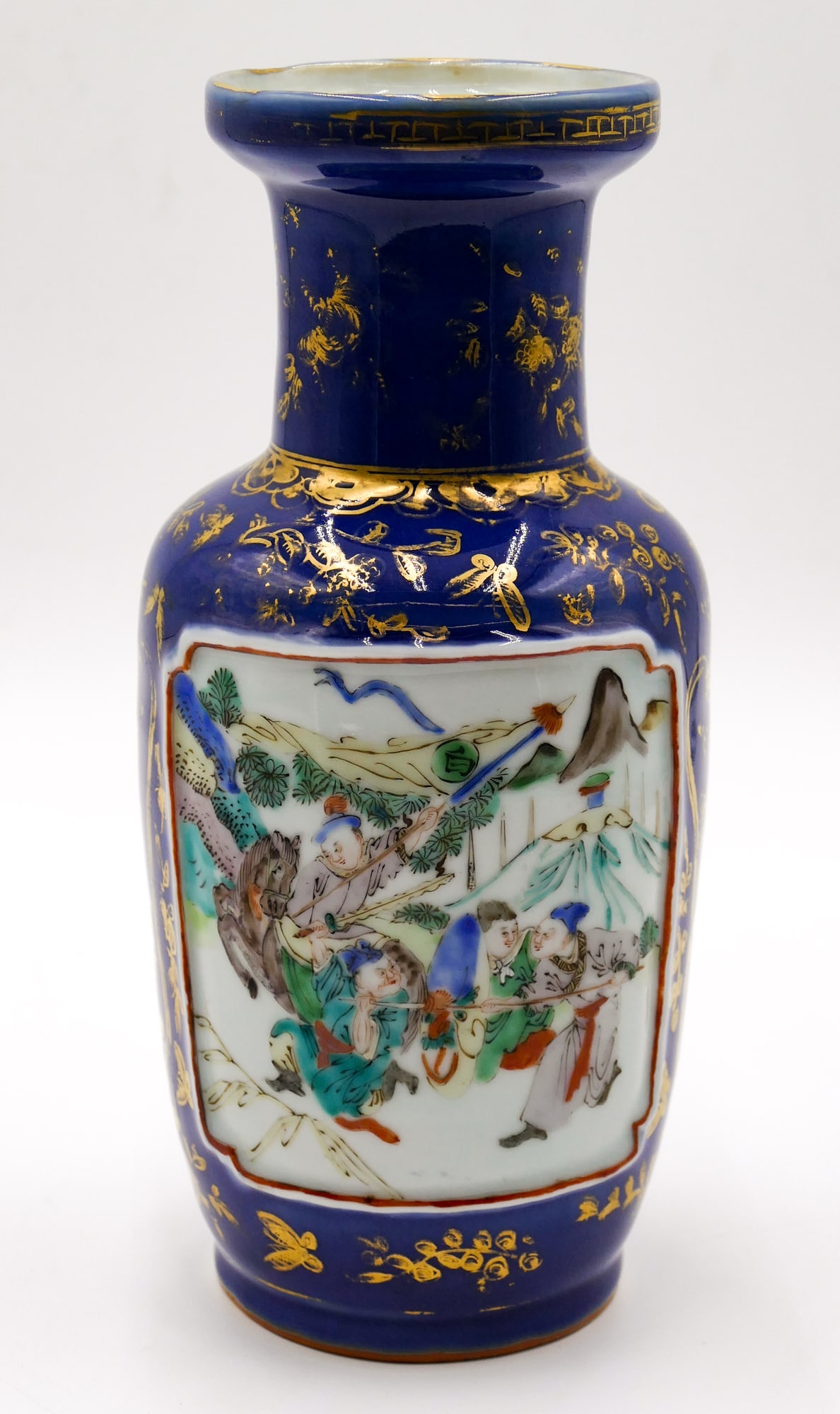 Old Chinese Cobalt Ground Gilt Rouleau Vase: Old Chinese Cobalt Ground Gilt Rouleau Vase 9.5 ". Polychrome enameled warriors on horseback. Unmarked. Overall excellent condition.