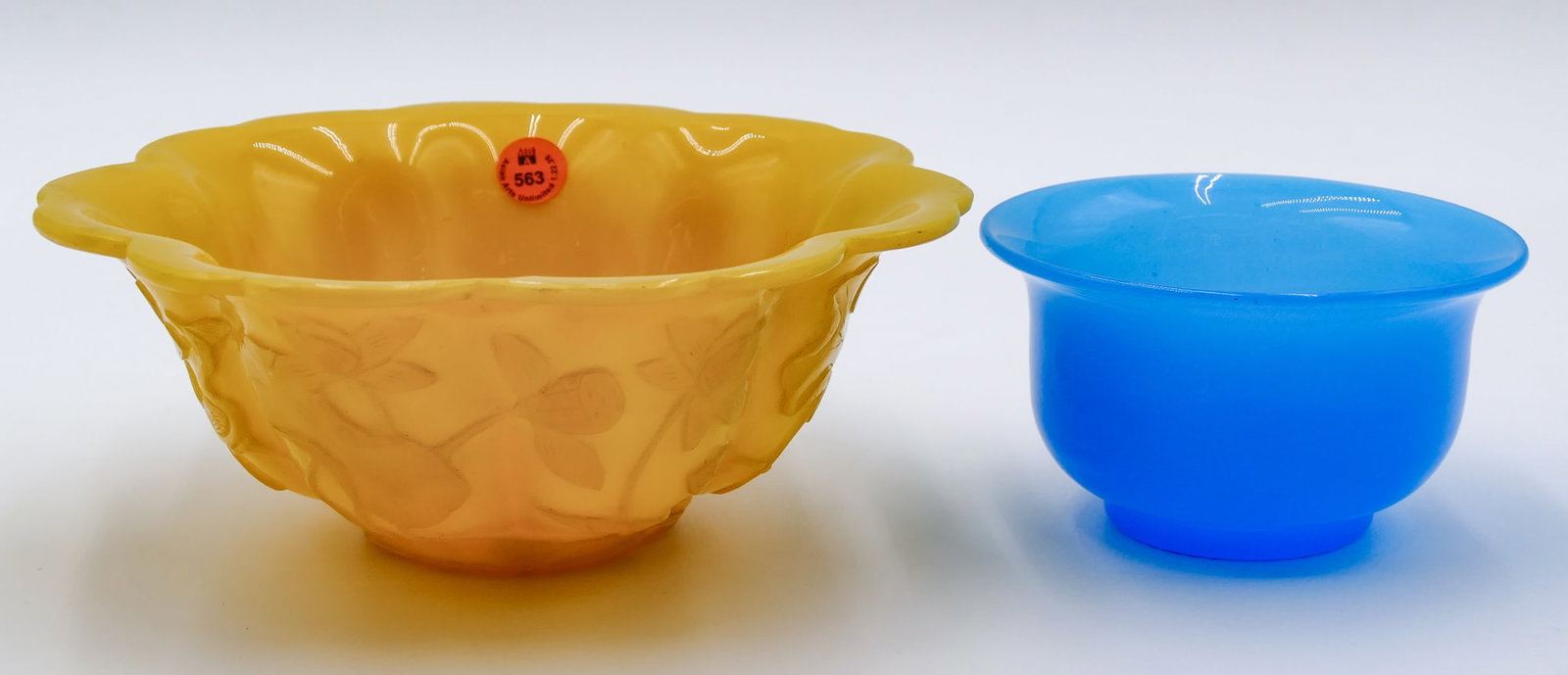2pc Old Chinese Peking Glass Bowls: 2pc Old Chinese Peking Glass Bowls 5 " to 9 ". Includes a blue tea bowl and carved floral yellow bowl. Overall excellent condition.