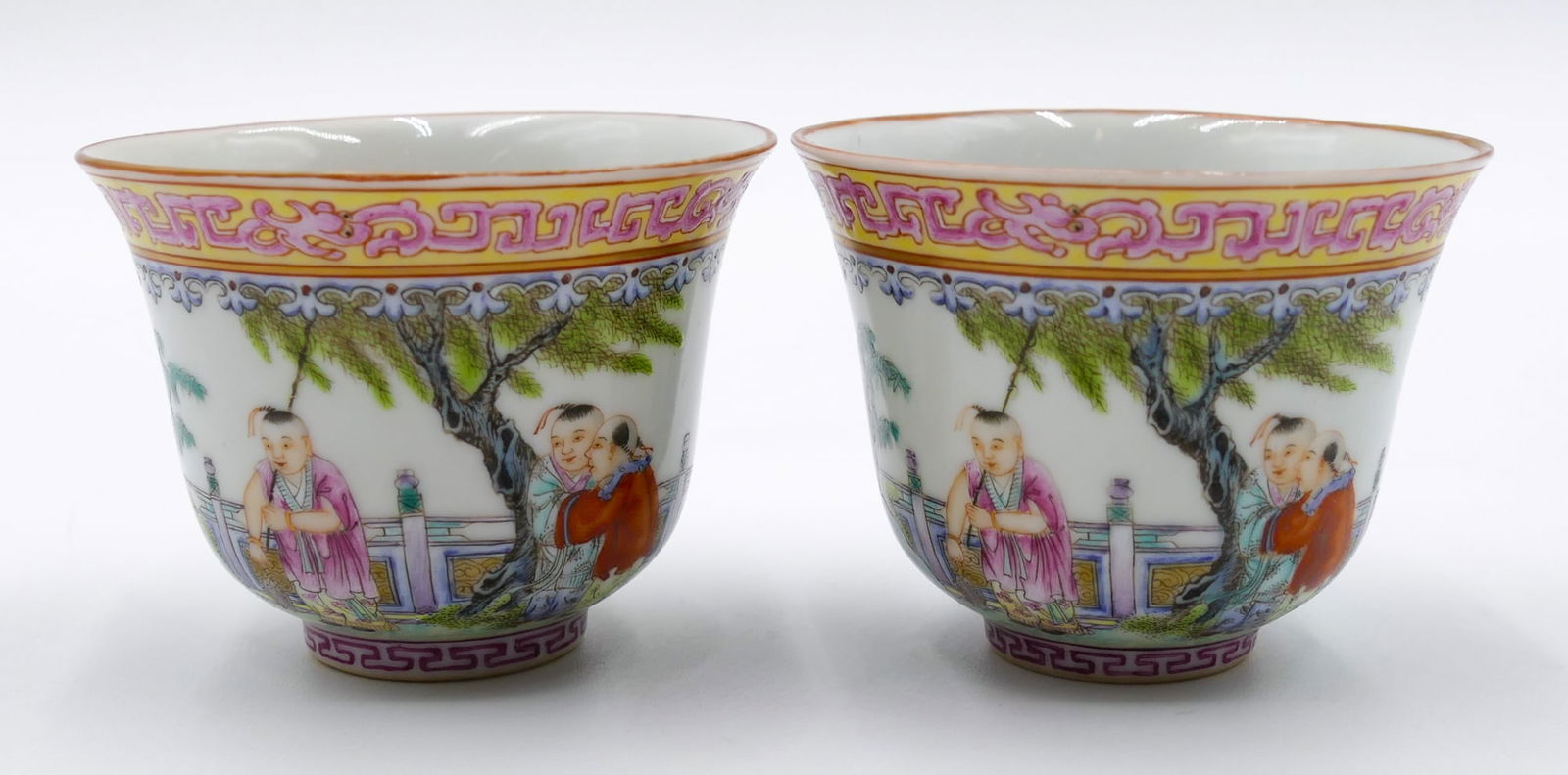 Pair Fine Chinese Famille Rose Tea Cups: Pair Fine Chinese Famille Rose Tea Cups 2.5 "x3 ". Intricate polychrome enameled with scholar and attendants. Red enameled Jiaqing mark. They come on fitted silk stands. Excellent condition.