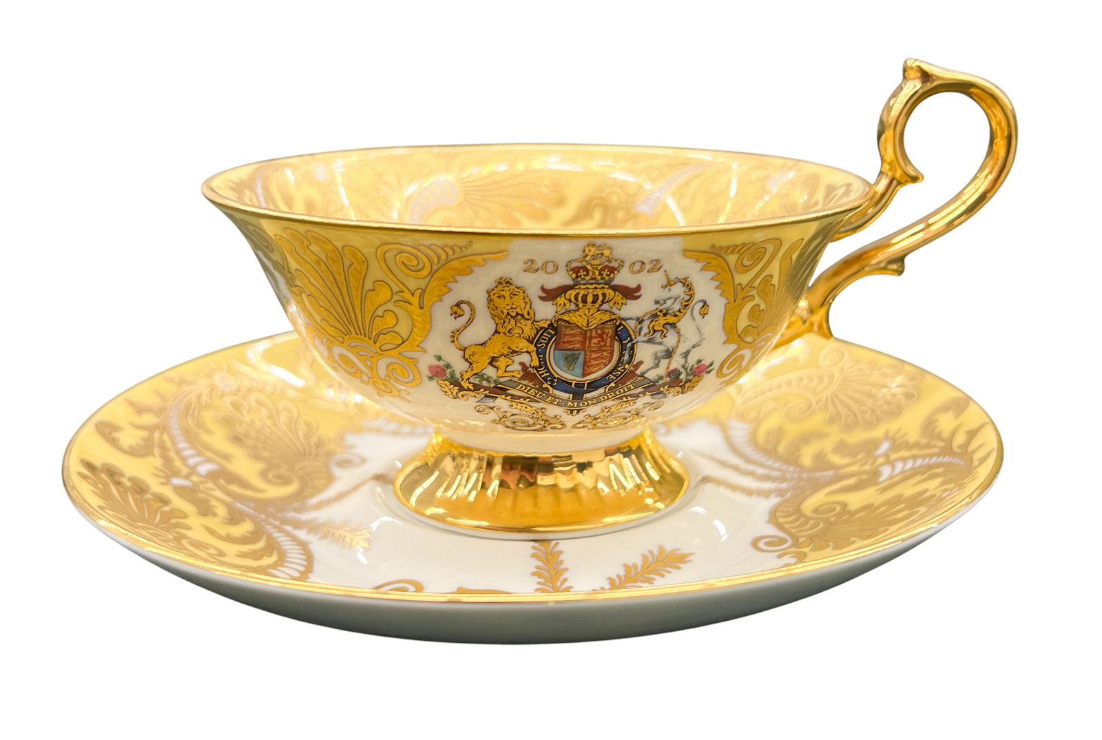 2002 English Fine Bone China Golden Jubilee Teacup & Saucer: 2002 English Fine Bone China Commemorative Golden Jubilee Teacup & Saucer w/ Original Box. Commemorates the 50th anniversary of the reign of Queen Elizabeth II. Numbered 1627 of 2000. Excellent