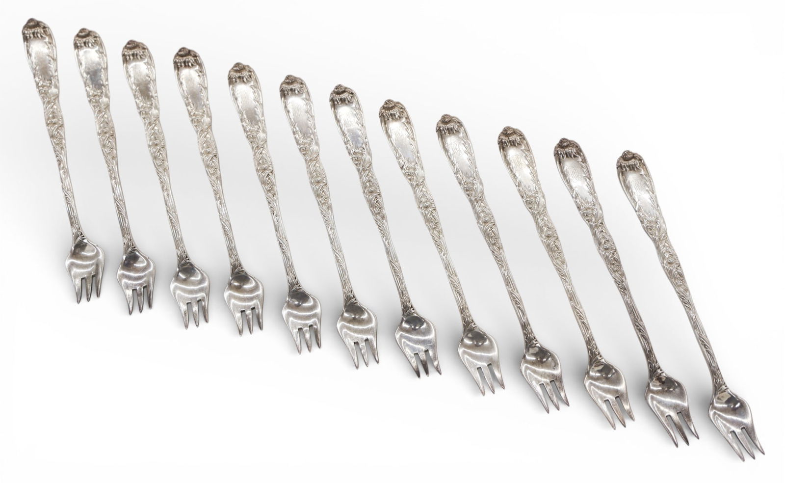 Set 12 Tiffany & Co. Sterling Chrysanthemum Oyster Forks: Set 12 Tiffany & Co. Sterling Chrysanthemum Oyster Forks 6". Old marks. Monogrammed with "BCC" on stem. Overall excellent condition. Set weighs 399 grams total.