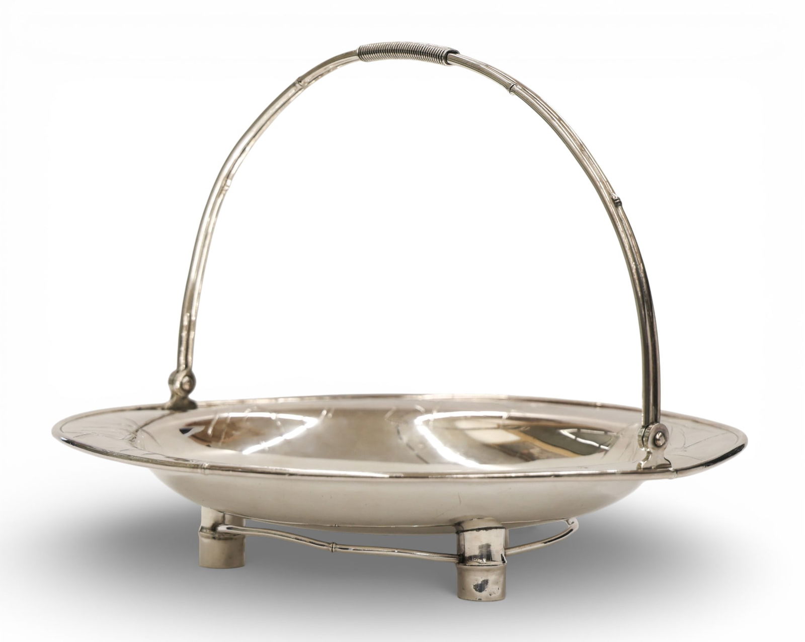 Chiyodaya Japanese Sterling Basket with Bamboo Motif: Chiyodaya Japanese Sterling Basket with Bamboo Motif 8"x10.5". Engraved bamboo motifs with figural handle. Marked on bottom with Jungin hallmark. Some minor indentations to bowl from feet and handle m