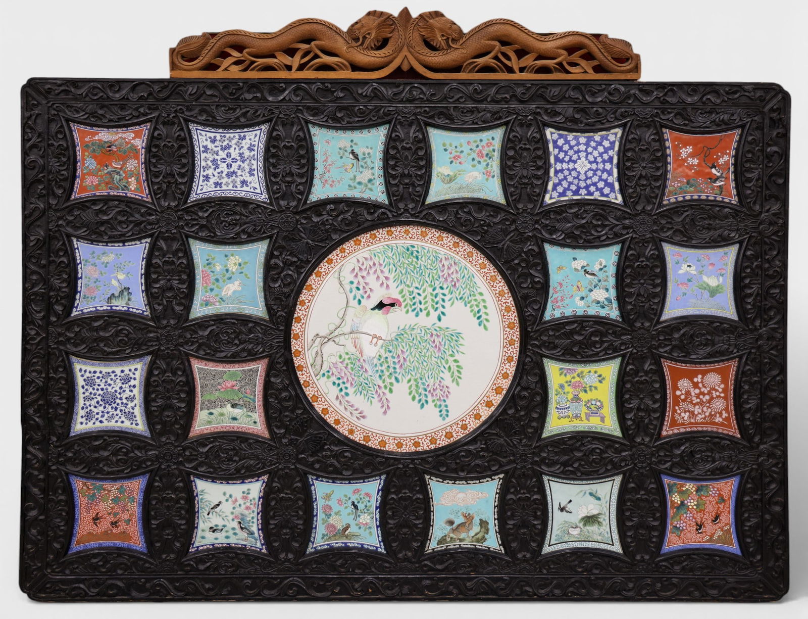 Impressive Chinese Porcelain Plaque Inset Hanging Panel: Impressive Chinese Porcelain Plaque Inset Hanging Panel 50"x65". Set with (21) polychrome painted porcelain plaques depicting various designs and animals. Smaller plaques measure 7" square, while larg