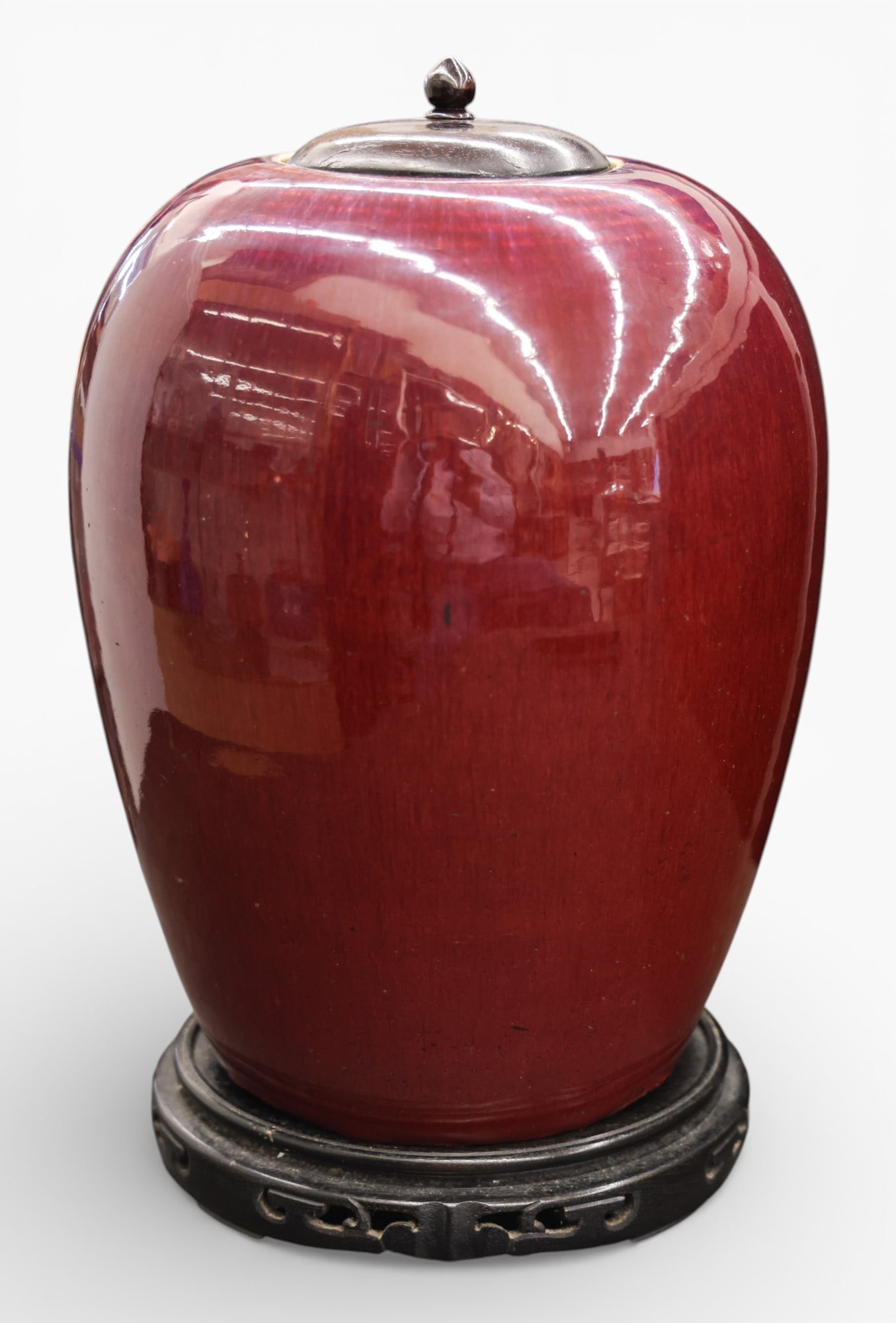 Antique Chinese Flambe Porcelain Jar on Stand: Antique Chinese Flambe Porcelain Jar on Stand 14"x8.5". Flambe to sang de boeuf glazes. Carved rosewood lid and stand. Spider web crack to underside with some inner rim chipping to top lip. 19th centu