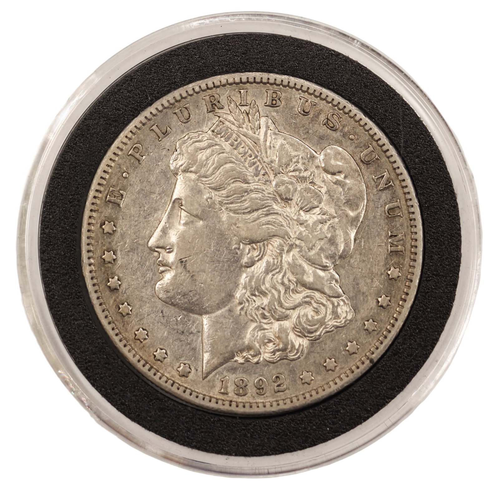 1892-S US Morgan Silver Dollar: 1892-S US Morgan Silver Dollar. AU-50 condition per consignor notes.