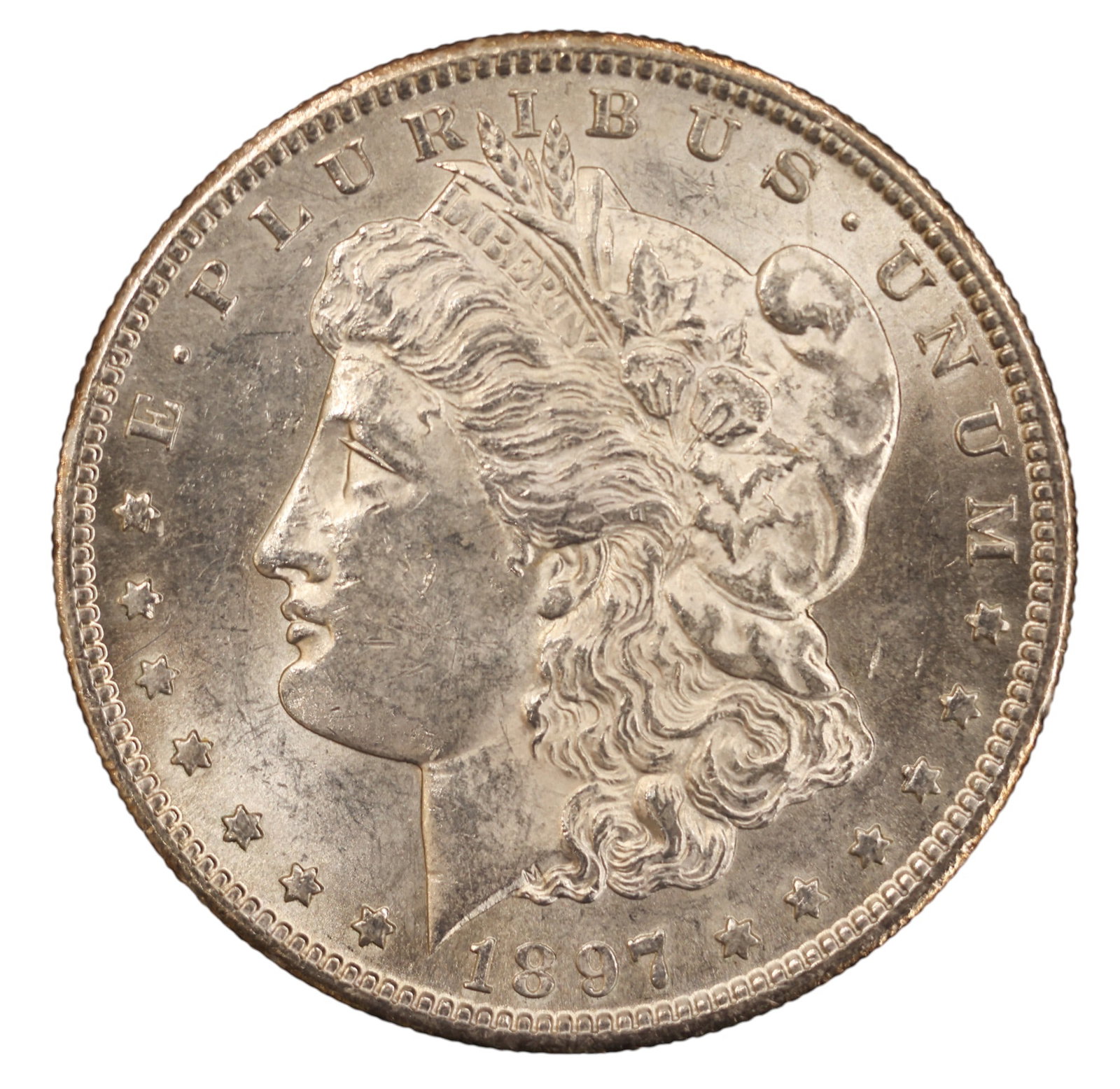 1897-S US Morgan Silver Dollar: 1897-S US Morgan Silver Dollar. MS-60 condition per consignor notes.