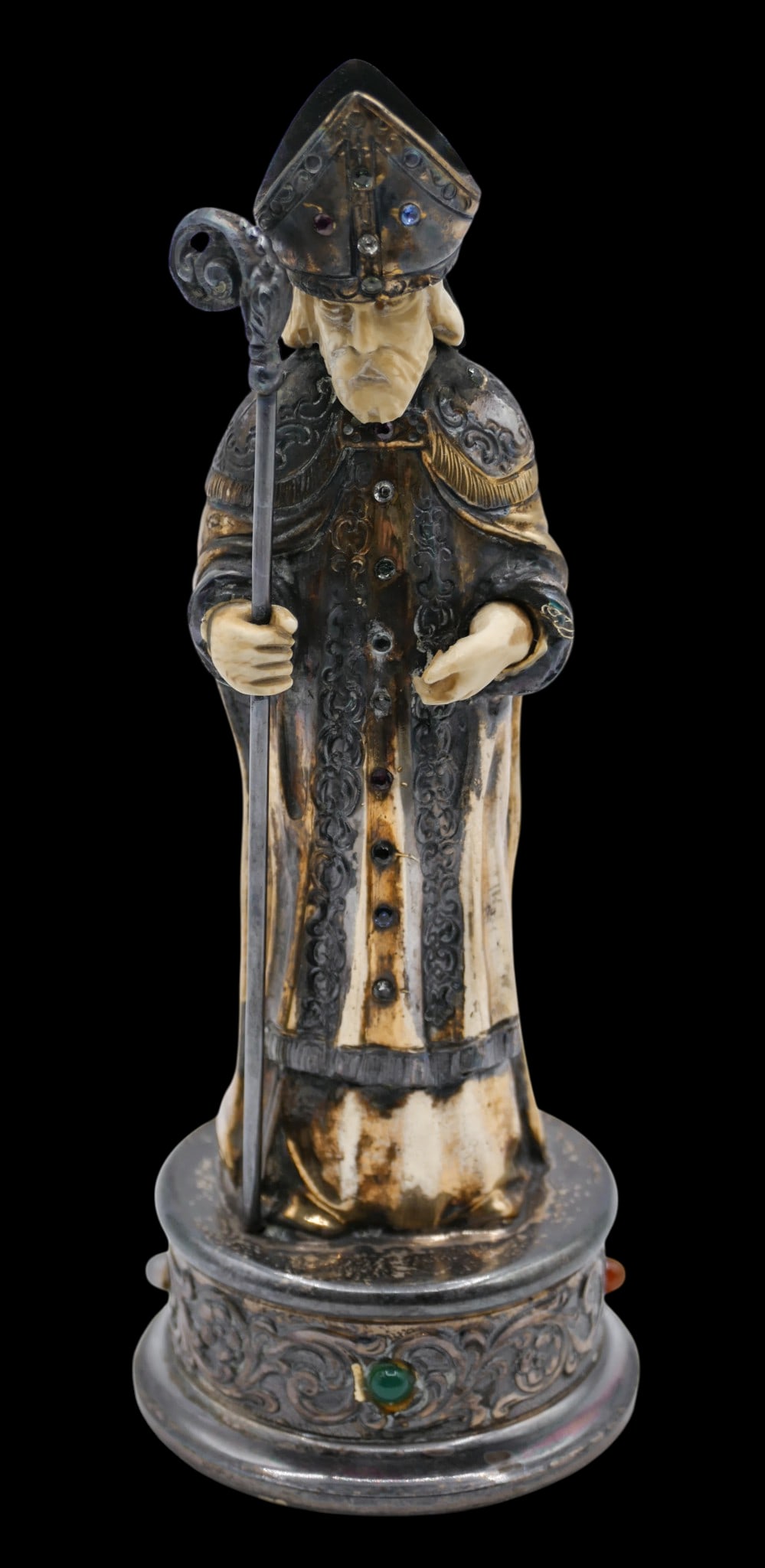 Israel Freeman German Jeweled Gilt Sterling Bishop Figurine: Israel Freeman & Son German Jeweled Gilt Sterling Bishop Figurine 6.5"x2.5". Carved face and hands with gemestone buttons and crown. Hallmarked on bottom edge. Overall excellent condition. It weighs