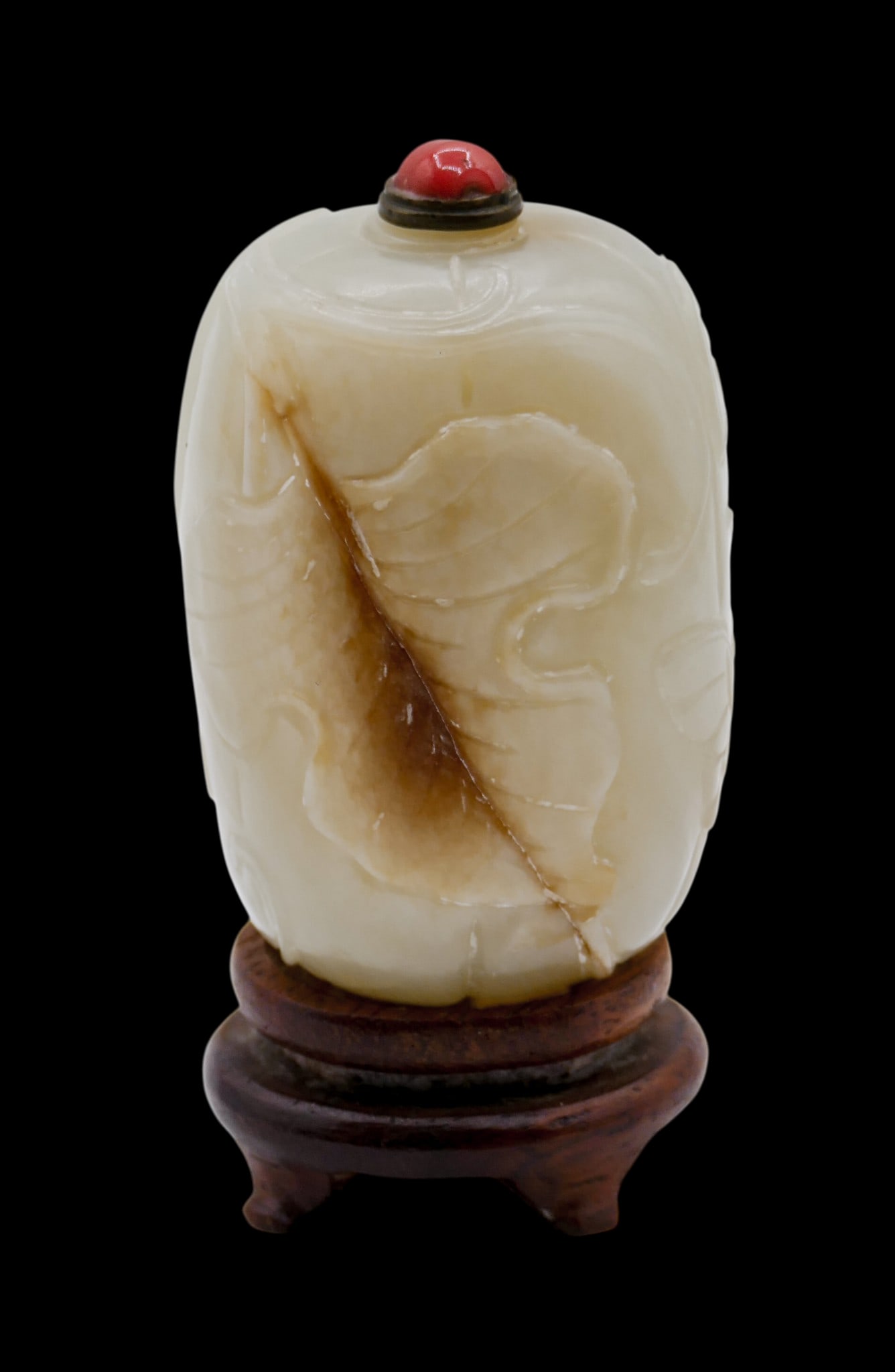 Old Chinese Jade Melon Form Snuff Bottle: Old Chinese Jade Melon Form Snuff Bottle 2.5"x1.5". Figural well-hollowed form with butterlfy and leaf vine carved motifs. Metal and coral stopper. Comes with rosewood stand. Excellent condition. 19th