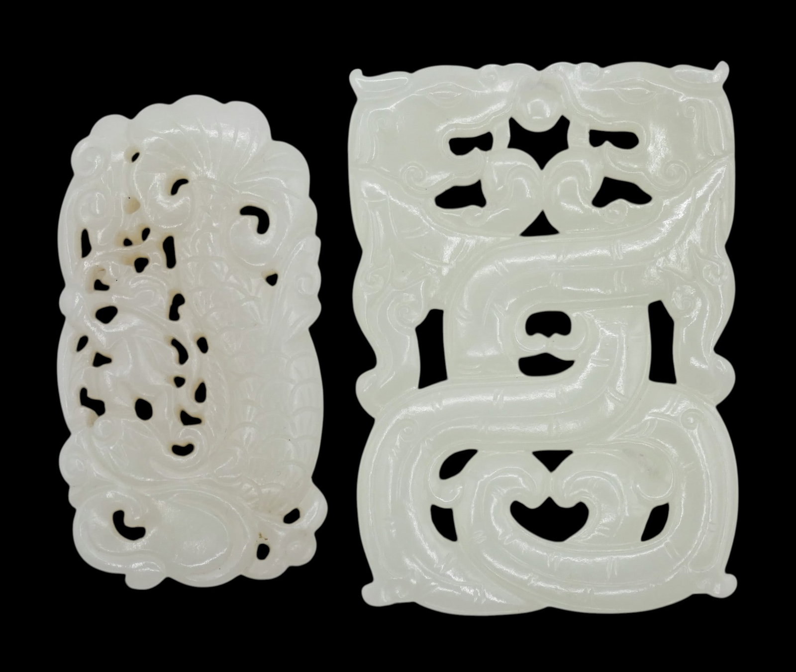 2pc Chinese White Jade Pierced Pendants: 2pc Chinese White Jade Pierced Pendants 2.25" to 2.5". Includes an opposing chilong pendant and dragonfish with boy. Excellent condition.