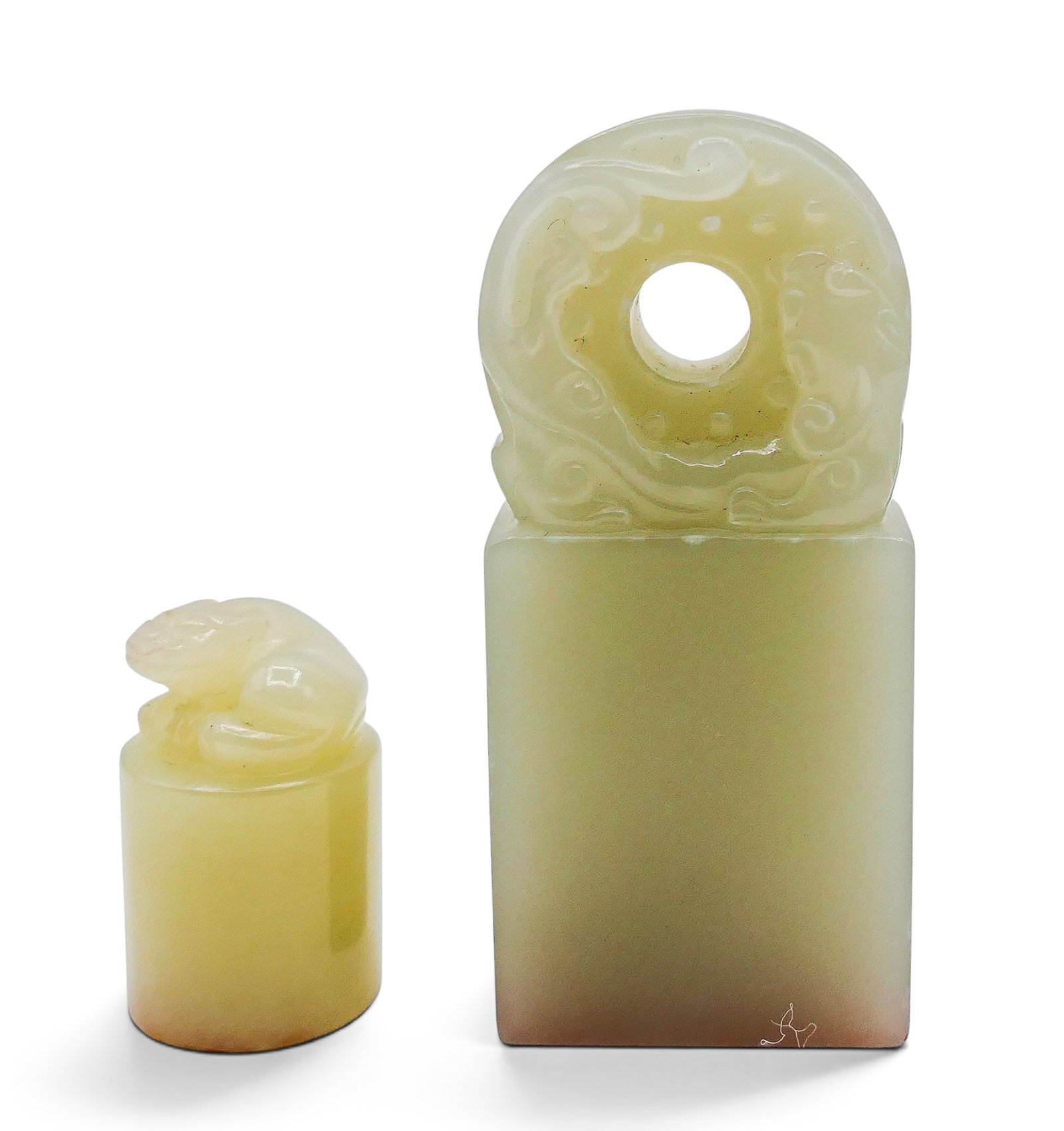 2pc Old Chinese Jade Seals: 2pc Old Chinese Jade Seals 1" to 2.5". Includes a chilong with bi disc and a small recumbant foo lion. Large seal has been carved with some use. Some edge chipping to larger seal. Overall excellent