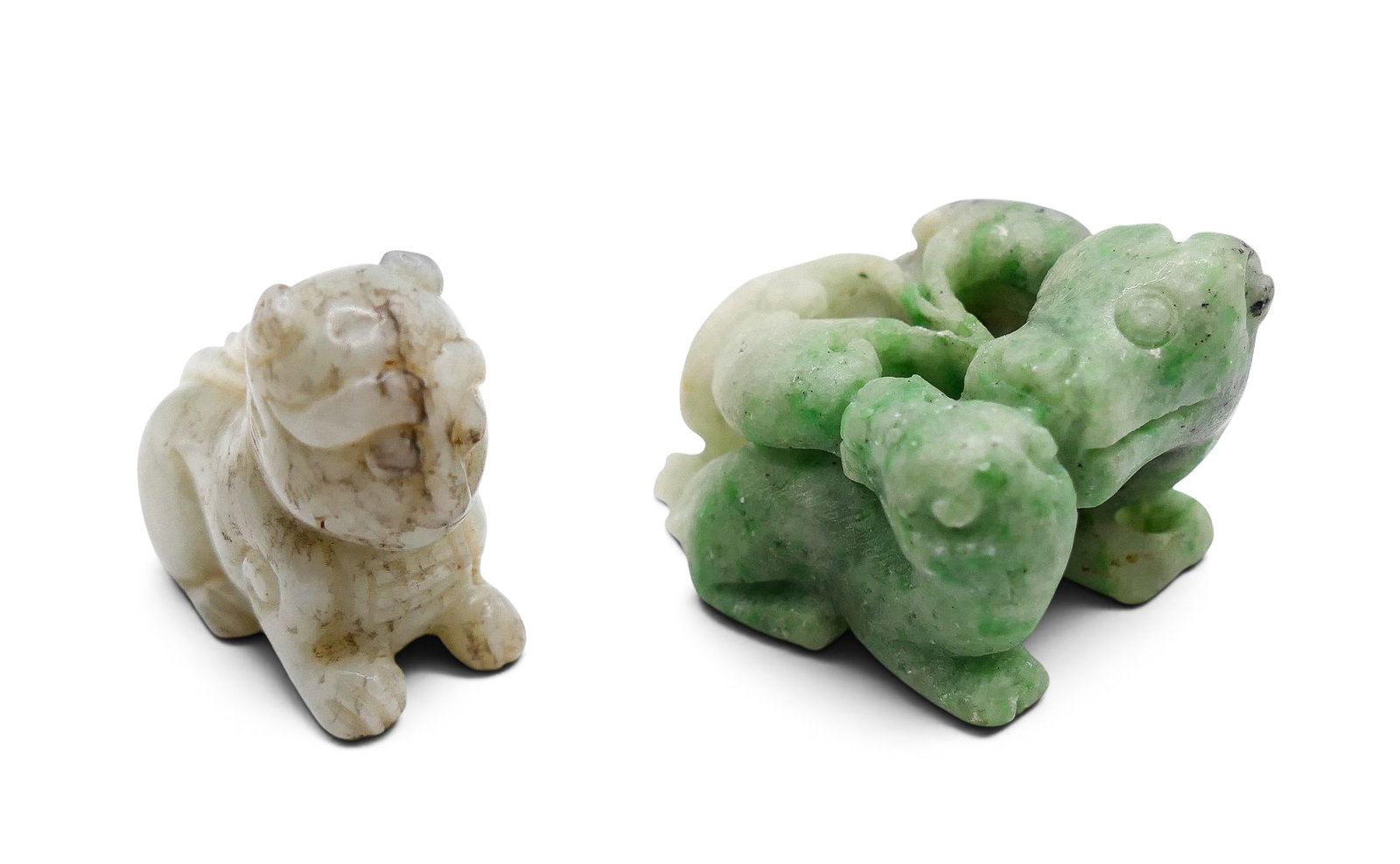 2pc Old Chinese Jade Small Foo Lions: 2pc Old Chinese Jade Small Foo Lions 1.5". Includes a seated white with black veining and apple greenish white carvings. Larger has some minor edge chipping. Overall excellent condition.