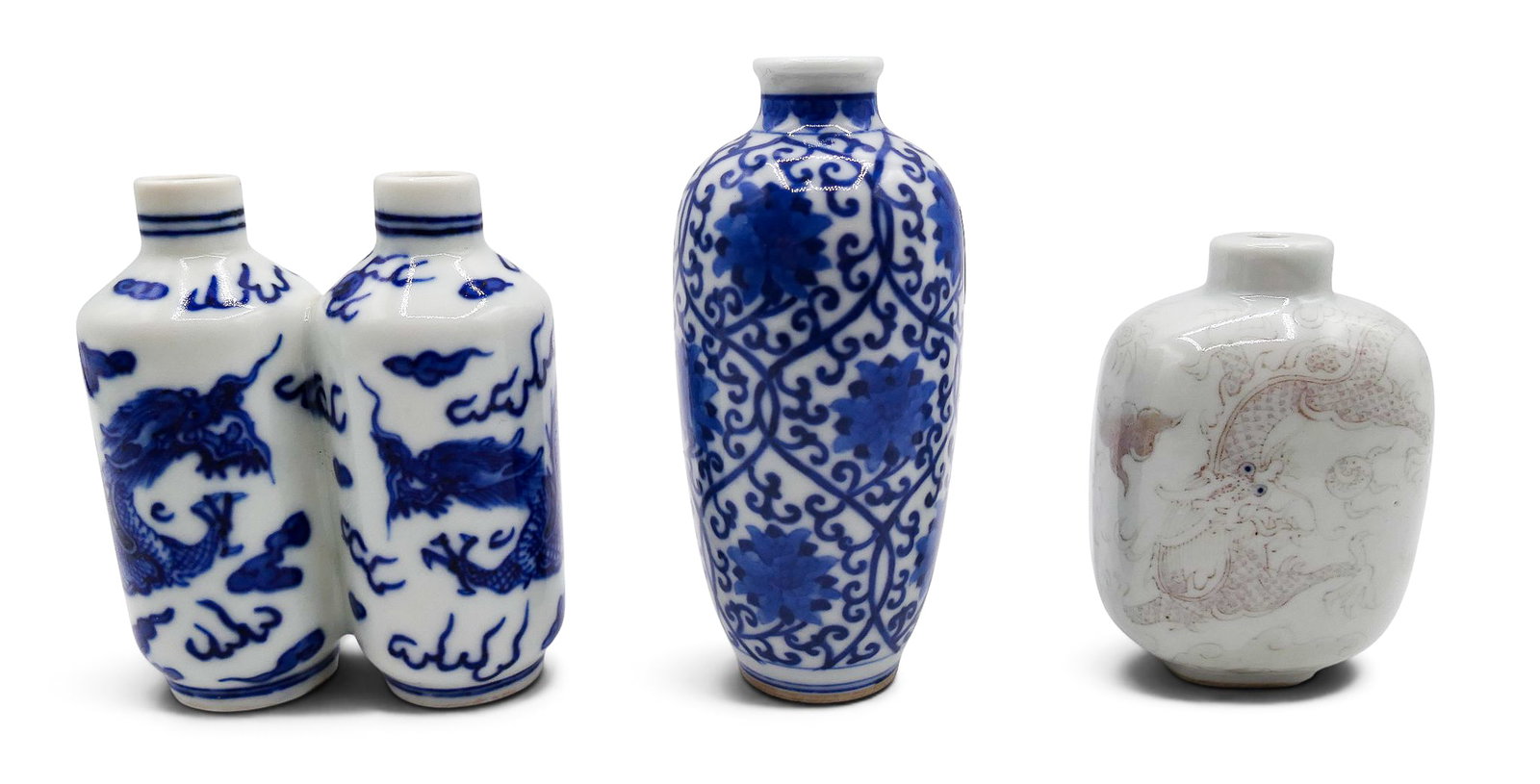 3pc Chinese Larger Porcelain Snuff Bottles: 3pc Chinese Larger Porcelain Snuff Bottles 3" to 3.75". Includes a scrolling lotus flower, double dragon snuff, and copper red dragon. Missing stoppers. Two have dynasty marks on bottom. Excellent