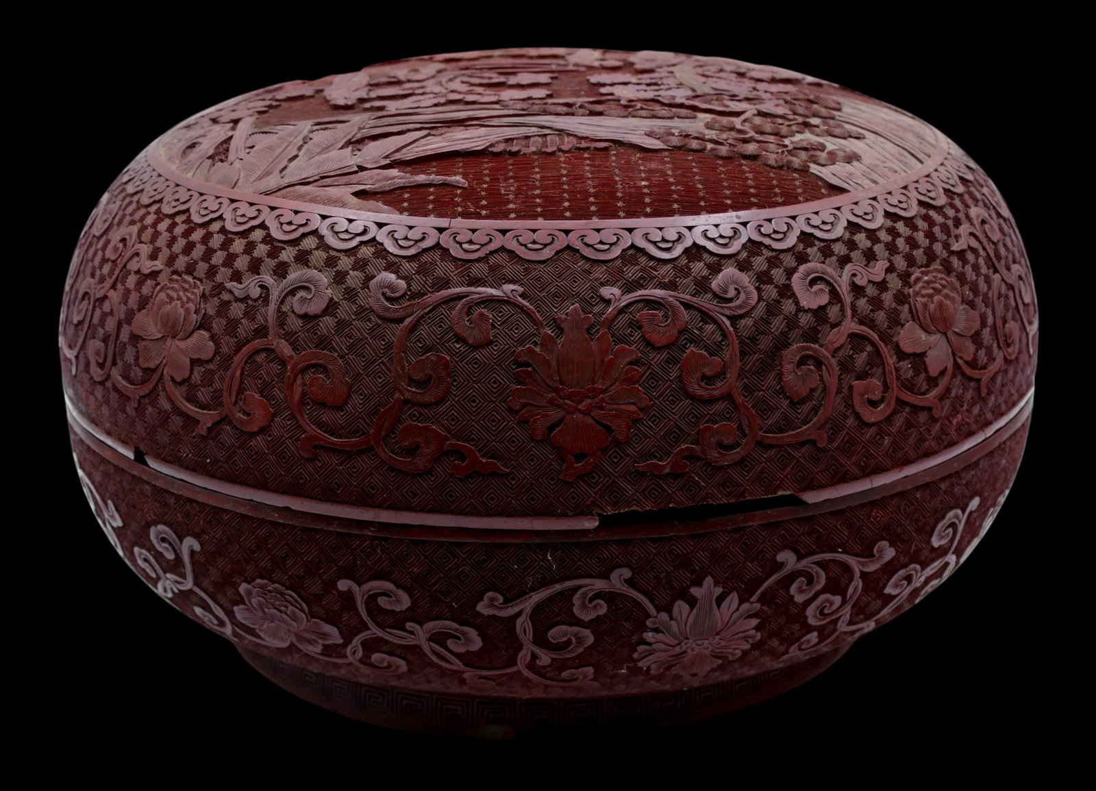 Antique Chinese Cinnabar Lacquer Round Box: Antique Chinese Cinnabar Lacquer Round Box 5.5"x10". Carved warriors on horseback in landscape motif. Unmarked. A large are of edge loss to top half with some loss to inner rim of bottom half. Form