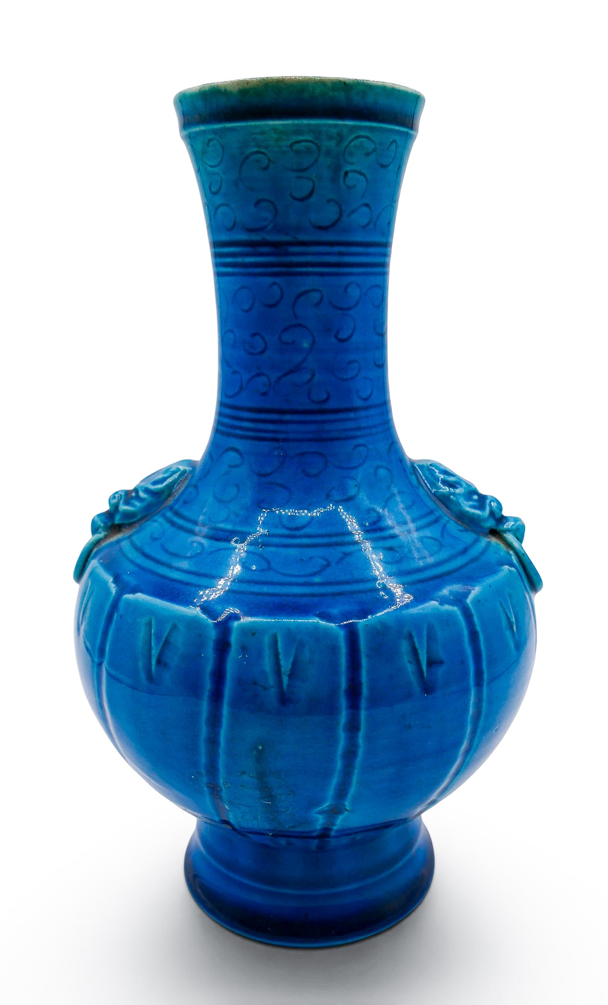 Old Chinese Peacock Blue Glazed Handled Porcelain Vase: Old Chinese Peacock Blue Glazed Handled Porcelain Vase 8.75"x5.25". Molded head and ring handles with carved stylized cloud motifs. Unmarked. Some glaze flaking on handle. Overall excellent