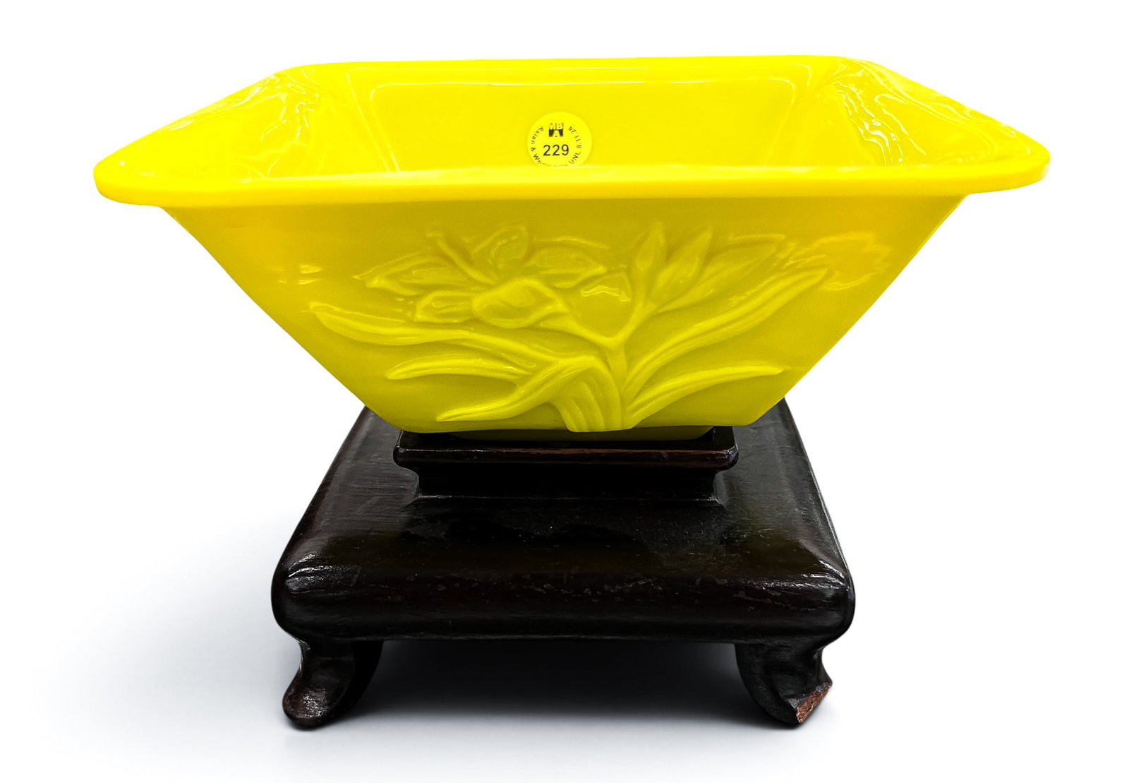 Old Chinese Peking Glass Yellow Flower Bowl on Stand: Old Chinese Peking Glass Yellow Flower Bowl on Stand 5"x7". Carved with four panels of blossoming flowers. Unmarked. Comes on fitted rosewood stand (damage to foot). Excellent condition.