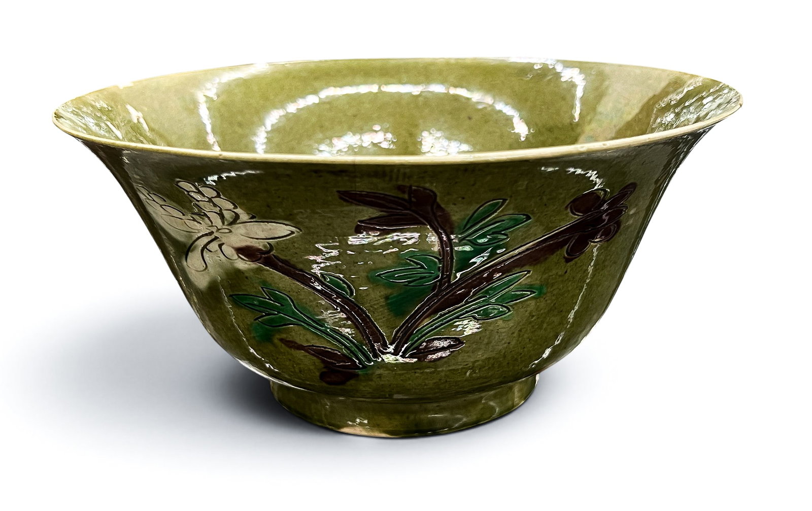 Antique Chinese Green Glazed Brinjal Bowl: Antique Chinese Green Glazed Brinjal Bowl 3.5"x7.75". Three carved floral motifs on exterior. Blue underglaze mark on bottom. Bowl has three hairline cracks and two small edge chips. 18th or 19th