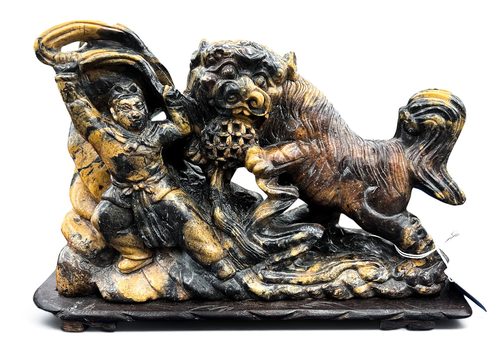 Old Chinese Soapstone Foo Lion with Warrior Carving on Stand: Old Chinese Soapstone Foo Lion with Warrior Carving on Stand 8"x12". Fitted carved wood stand. Chip to top edge of warrior. Overall excellent condition.