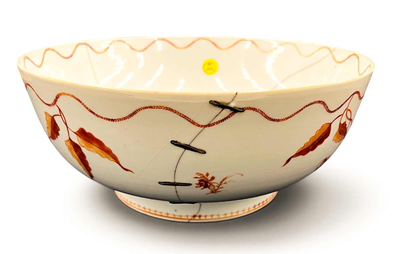 Antique Chinese Export Porcelain Punch Bowl as-is: Antique Chinese Export Porcelain Punch Bowl as-is 4.5"x11". Red floral decoration with large staple repairs. 18th century, Qing dynasty.