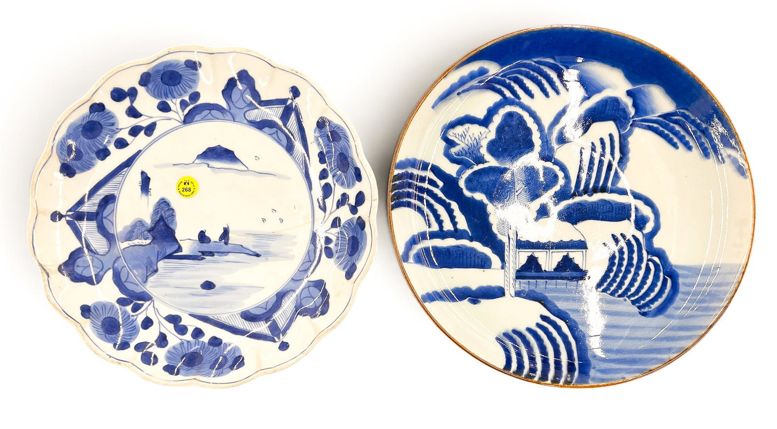 2pc Antique Japanese Arita Porcelain Chargers: 2pc Antique Japanese Arita Porcelain Chargers 12" Approx. Smaller has large crack and some edge chipping. Other is free from damage.