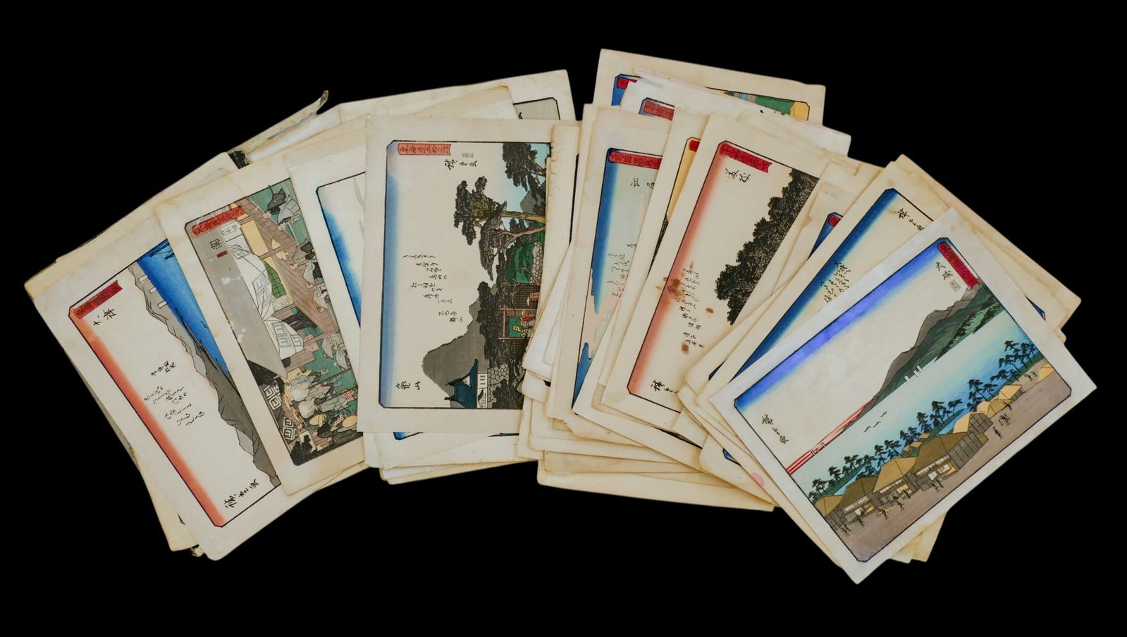 Old Hiroshige "Fifty-Three Stations of Tokaido" Woodblock Print Album: Old Hiroshige "Fifty-Three Stations of Tokaido" Woodblock Print Album 9'x11.5". Includes a complete suite of (53) images loose from their folio. Some scattered edge wear and a few have staining.
