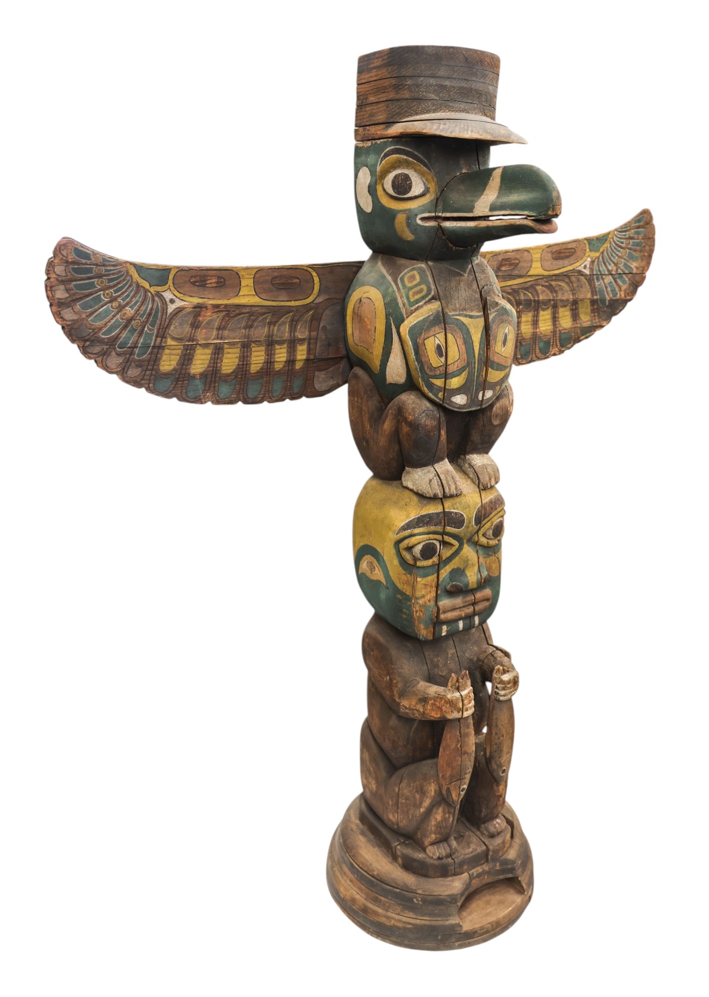 Antique Haida Large Polychrome Cedar Totem Pole Model: Antique Haida Large Polychrome Cedar Totem Pole Model 42"x33"x13". An early trade totem featuring a thunderbird with hat and human form holding salmon. Polychrome painted with green and yellow